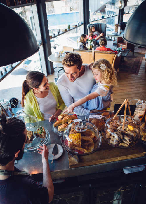 A family eating in a restaurant near The Mill at Westside in Atlanta, Georgia