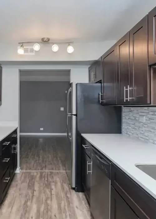 Well-lit kitchen at Mount Prospect Greens Apartments in Mt Prospect, Illinois