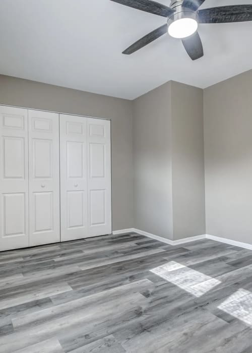 Bedroom with a ceiling fan and a large window at Woodside Village in Valparaiso, Indiana