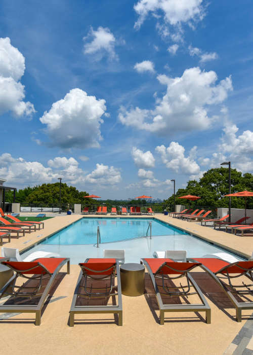A resort-style swimming pool and lounge chairs at The Mill at Westside in Atlanta, Georgia
