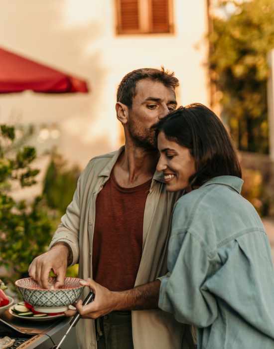 A lovely couple having a bonding moment while making food with BBQs/Grills at The Indie Glendale Collection in Glendale, California
