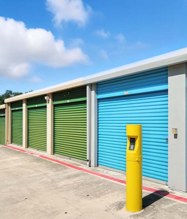 A customer holding a packed box at Storage Hub - Redland in San Antonio, Texas