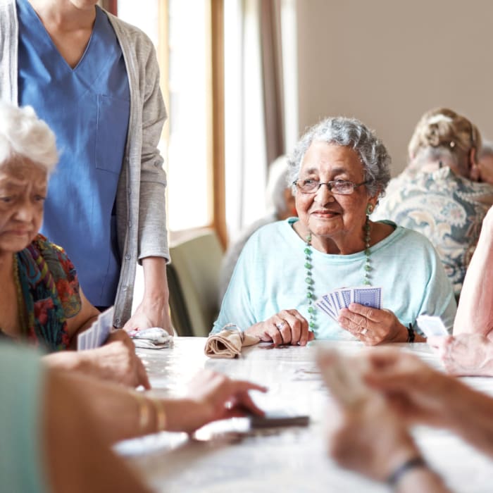 Resident enjoying a social event at Innovation Senior Living in Winter Park, Florida