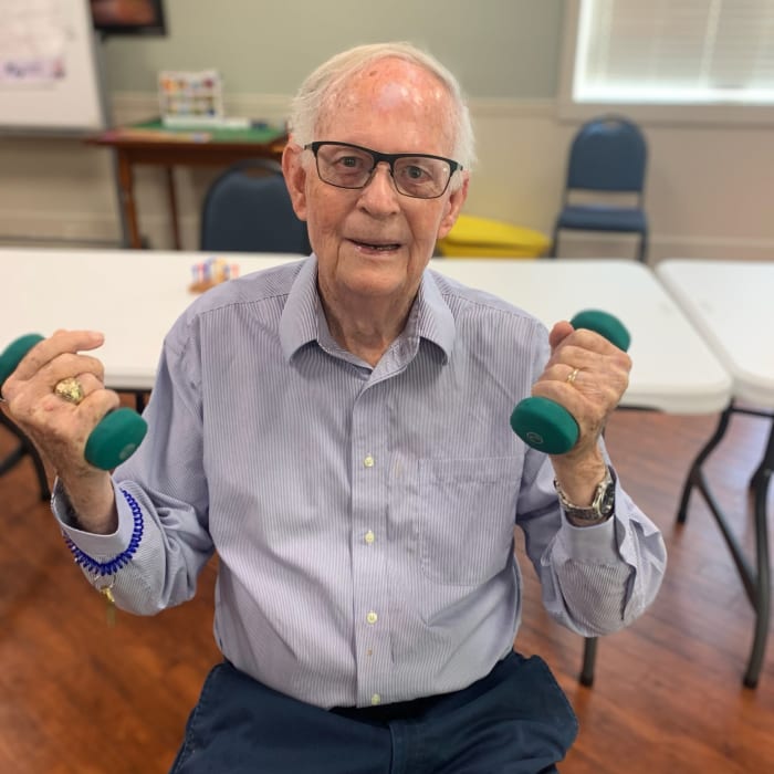 Resident lifting weights at The Florence Presbyterian Community in Florence, South Carolina
