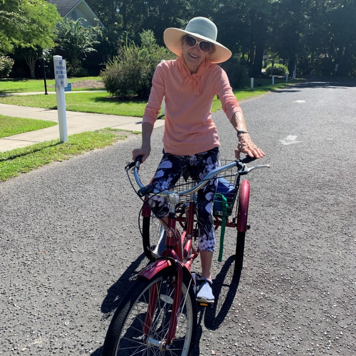 Resident riding a 3 wheeled bike near The Village at Summerville in Summerville, South Carolina