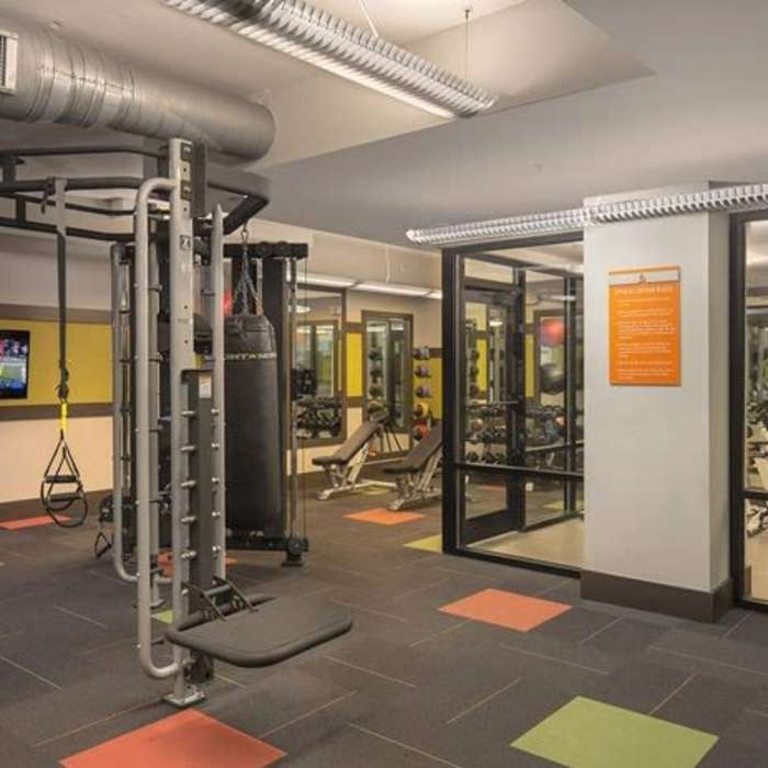 Resident lifting weights at The Cliftwood in Sandy Springs, Georgia