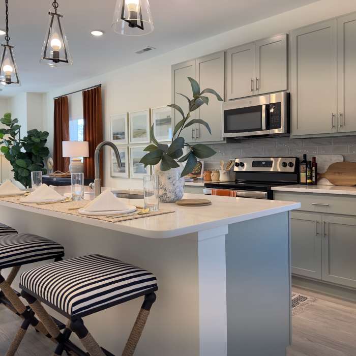 Kitchen with breakfast counter at Encore at Westgate in Leland, North Carolina