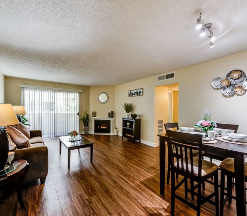 A spacious living room with wood-style flooring at The Ritz in Studio City, California