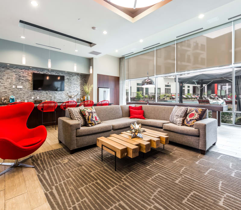 Sectional sofa with side chair and decorative coffee table in clubhouse at Marq on Burnet in Austin, Texas