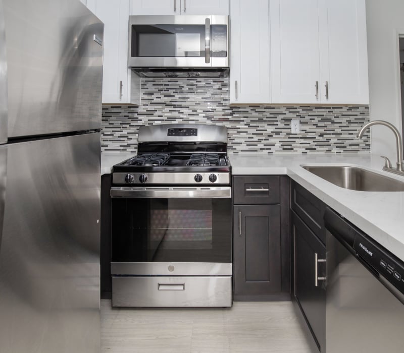 Model kitchen with stainless-steel appliances at Club Marina Apartments in Los Angeles, California
