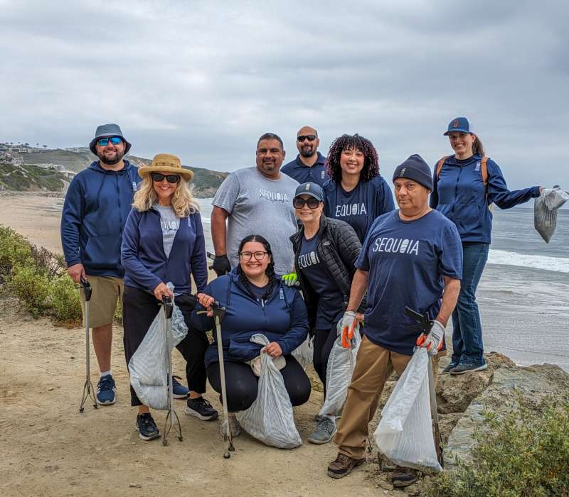 Sequoia team members in Southern California cleaning up a local beach