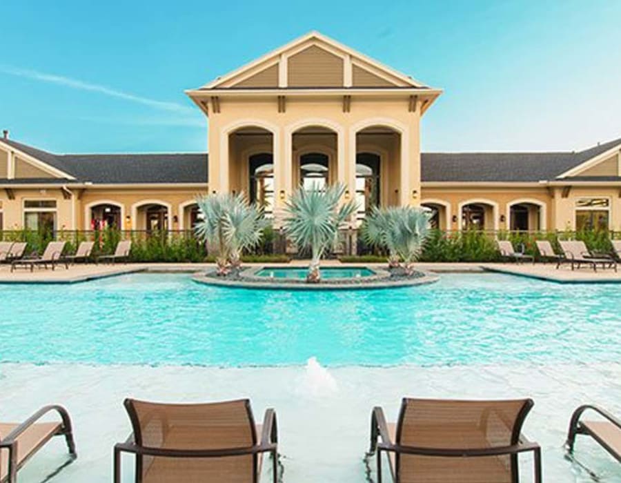 pool and outdoor seating area at Palms at Cinco Ranch in Richmond, Texas