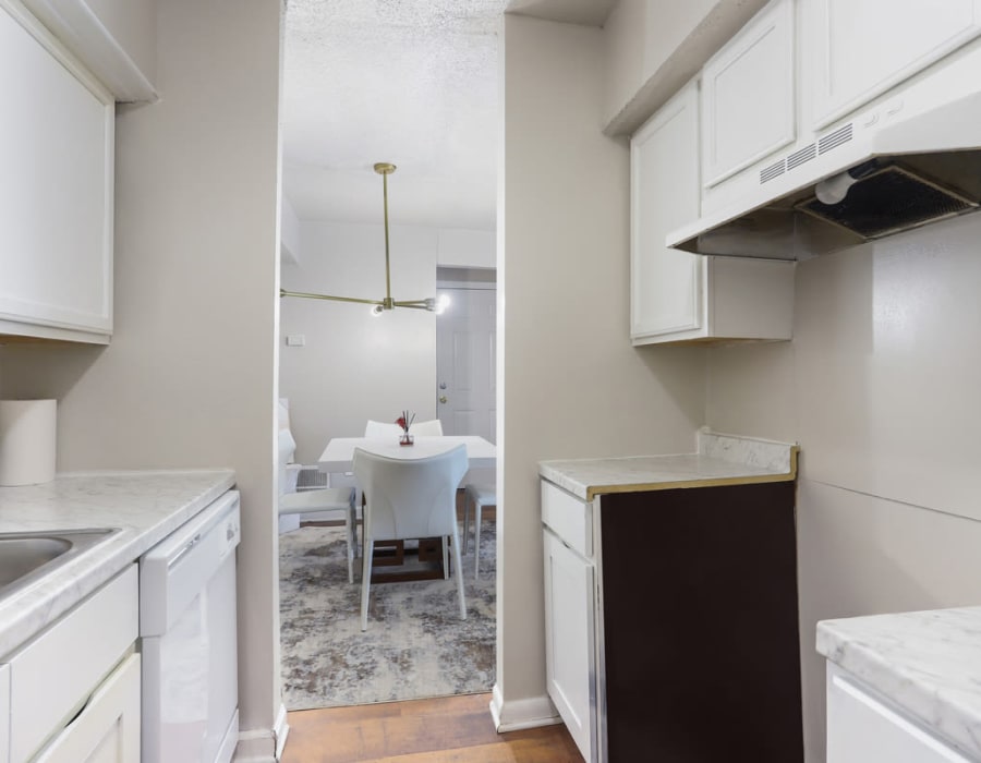 Model apartment kitchen and dining room at Residences at Glen Oaks in Jackson, Mississippi