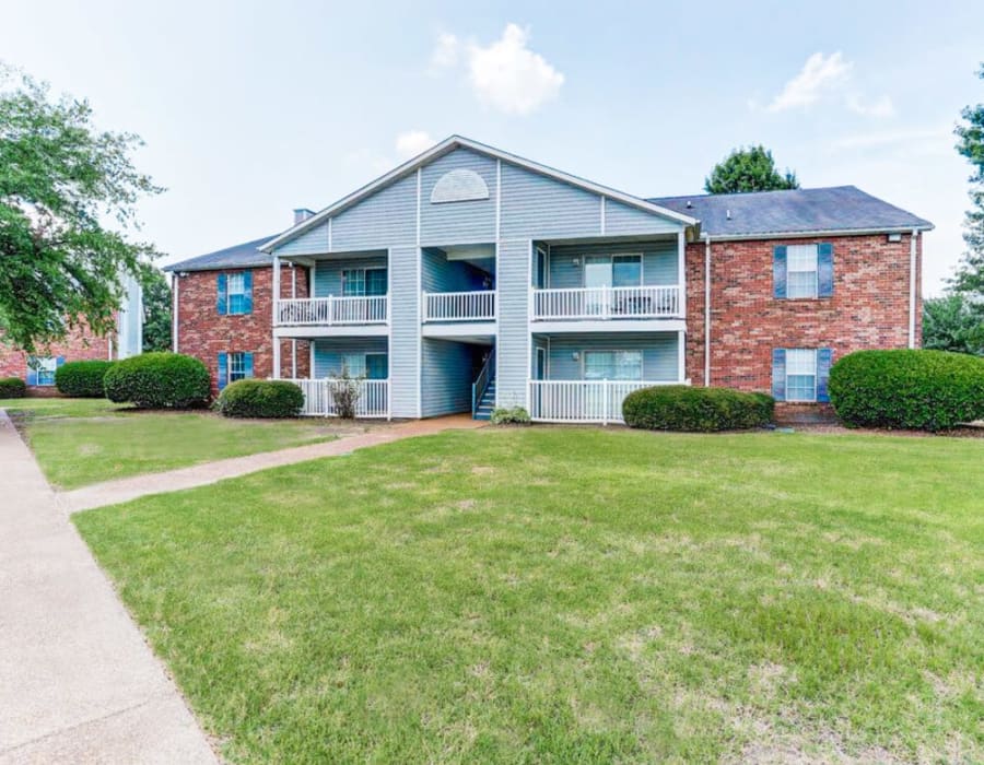 Paved walkway through the lawn outside of The Crescent at 161 in Walls, Mississippi