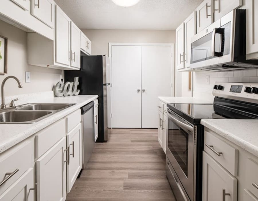 Apartment kitchen with stainless steel finishes at Indigo at 61 in Robinsonville, Mississippi