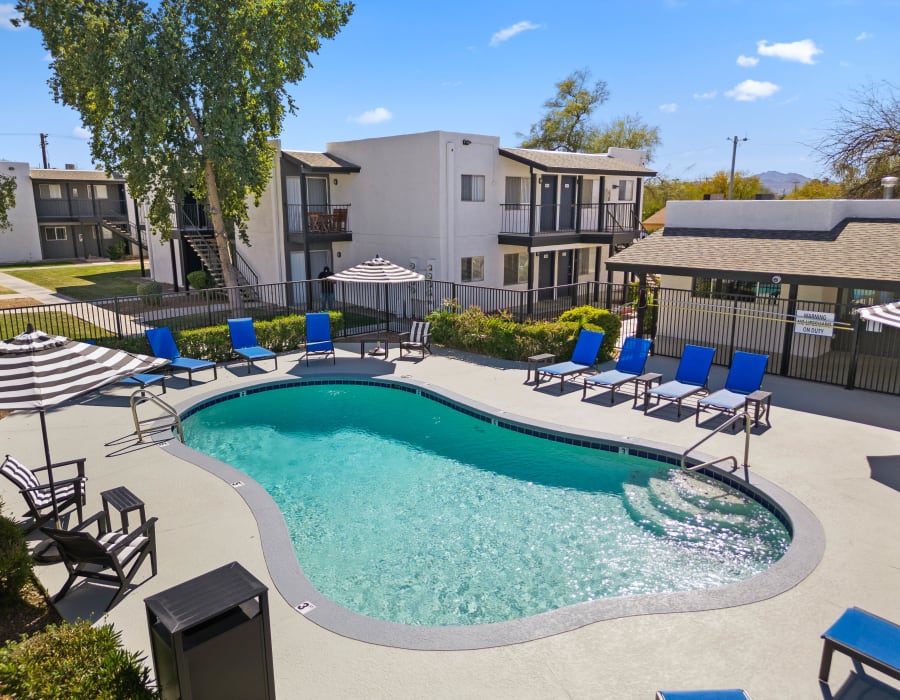 Take a dip in our outdoor swimming pool at Las Brisas Apartments in Tucson, Arizona
