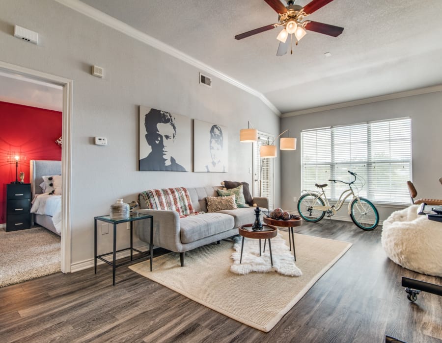 Model living space with red accents at The Anthony at Canyon Springs in San Antonio, Texas