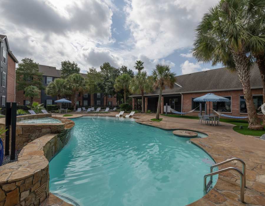 Seating by the pool at Compass at Windmill Lakes in Houston, Texas