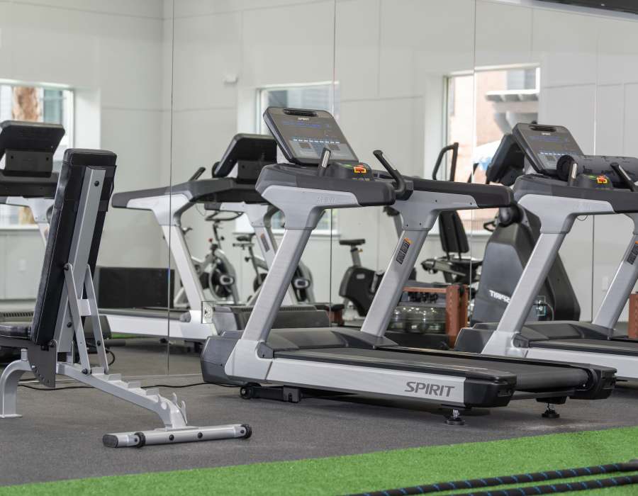 Exercising equipment in the fitness center at Compass at Windmill Lakes in Houston, Texas