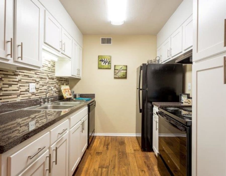 Hallway apartment kitchen at Acasă Prosper Fairways in Columbia, South Carolina