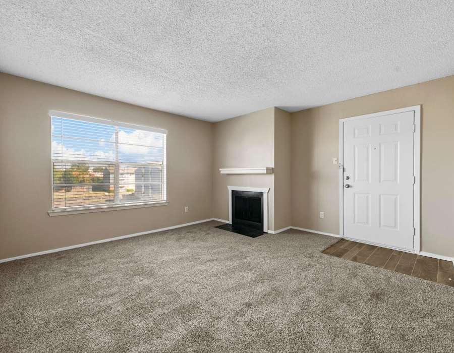 Bedroom with a window and a fireplace at Misty Hollow in Arlington. TX  