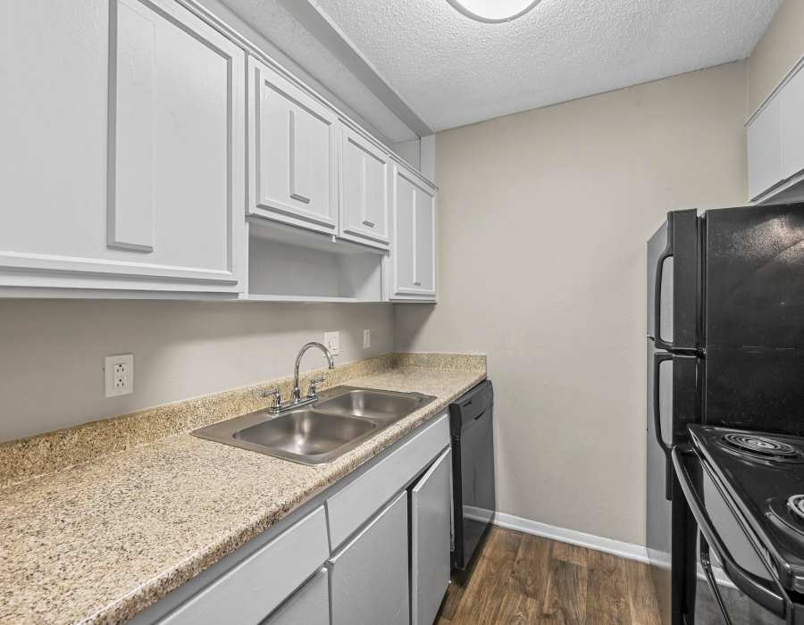 Kitchen with refrigerator atFinley Square in Irving. TX