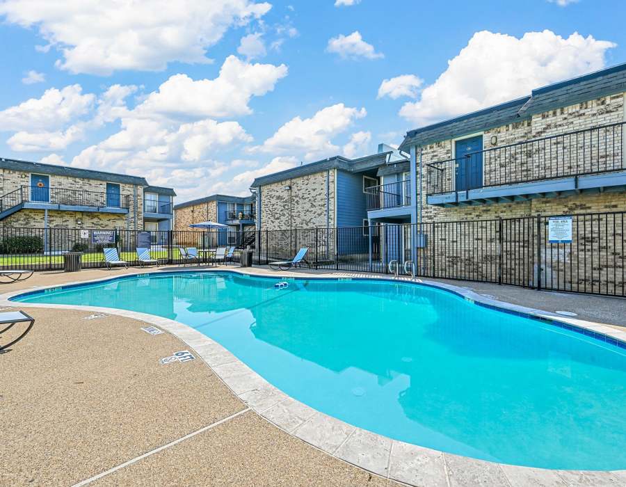  Swimming pool with view of apartment atFinley Square in Irving. TX