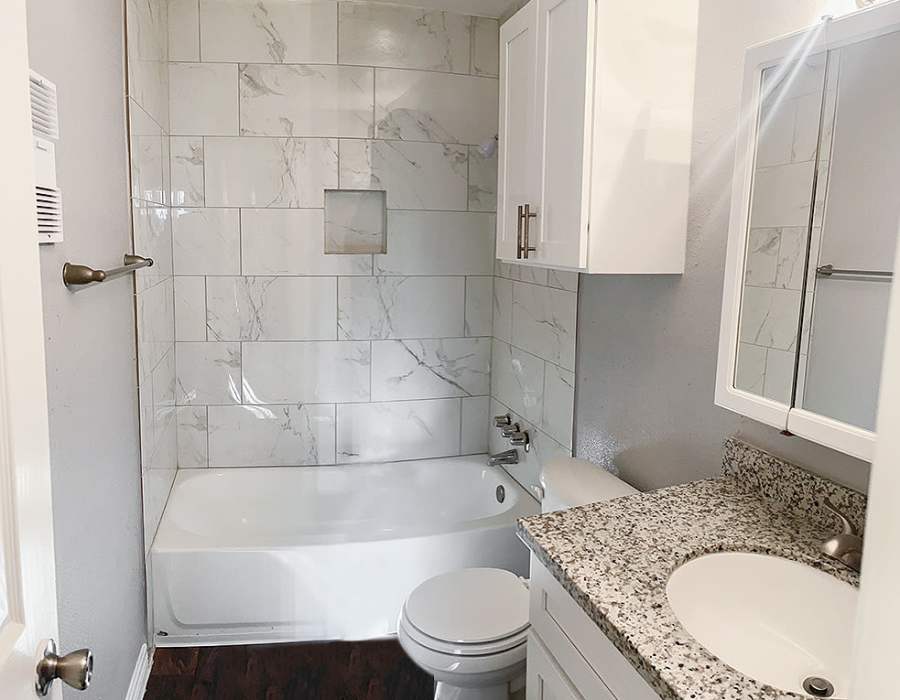 Bright bathroom with shower and tub at Oaks of Wimbledon in Spring, Texas, 
