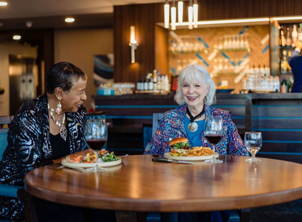Residents at table in restaurant at Murano in Seattle, Washington