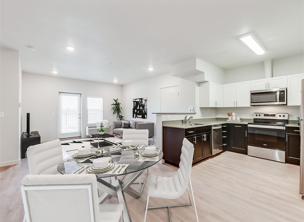 Sleek modern kitchen, dining room and living room at Kestrel Park in Vancouver, Washington