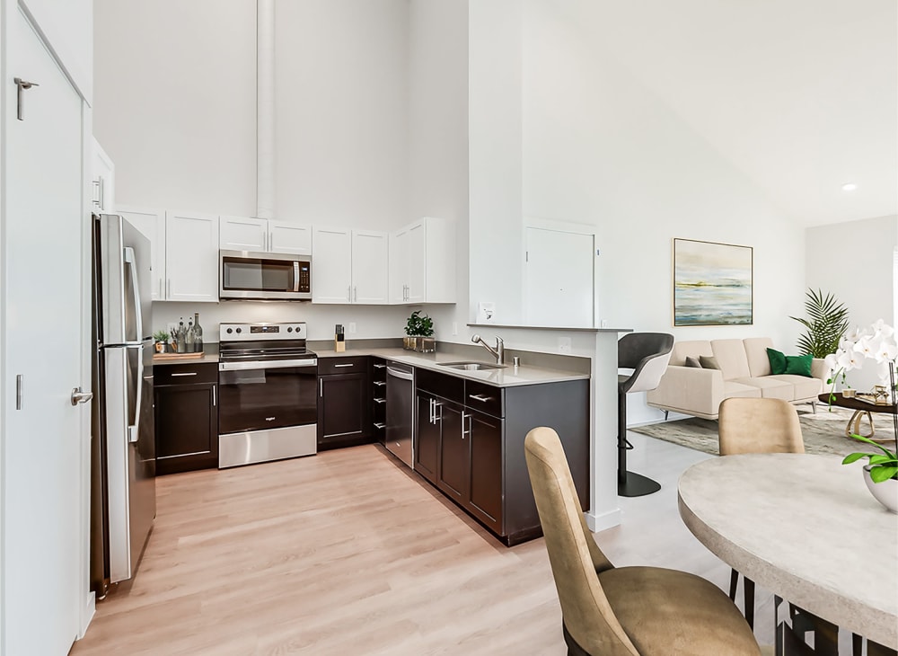 An apartment's full kitchen with modern furnishings at Kestrel Park in Vancouver, Washington