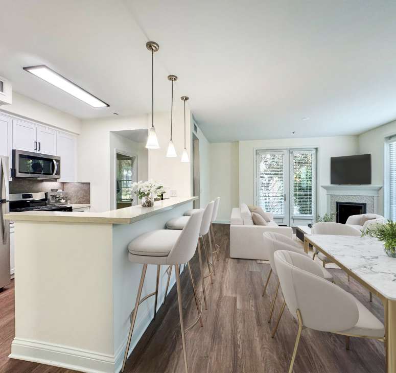 Stainless-steel appliances and quartz stone countertops in the model kitchen at La Belle at Hollywood Tower in Los Angeles, California