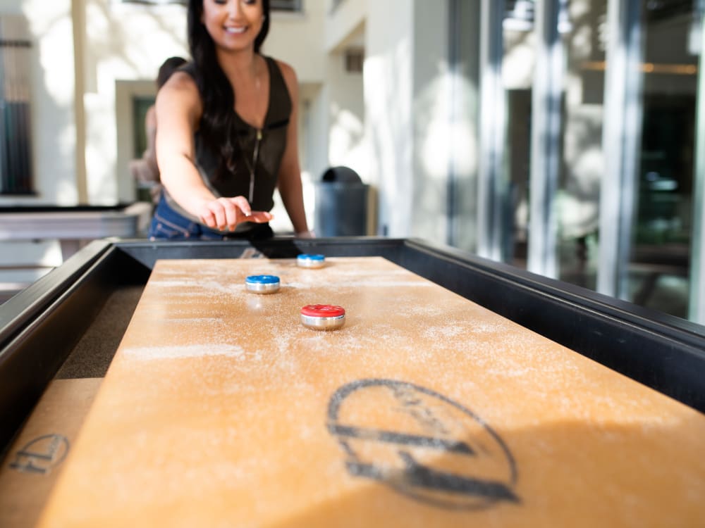Residents playing shuffleboard in the clubhouse at The Hyve in Tempe, Arizona