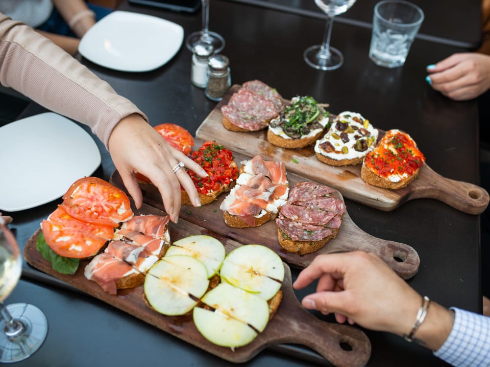 Residents enjoying appetizers at a restaurant near The Regents at Scottsdale in Scottsdale, Arizona