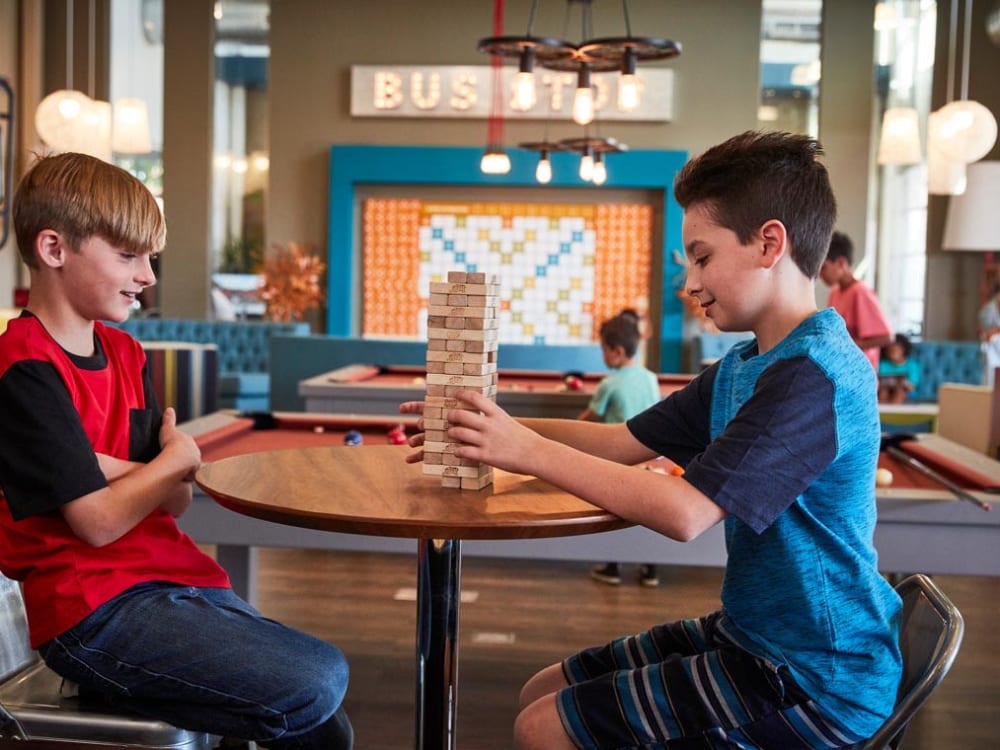 Kids playing Jenga at BB Living at Eastmark in Mesa, Arizona