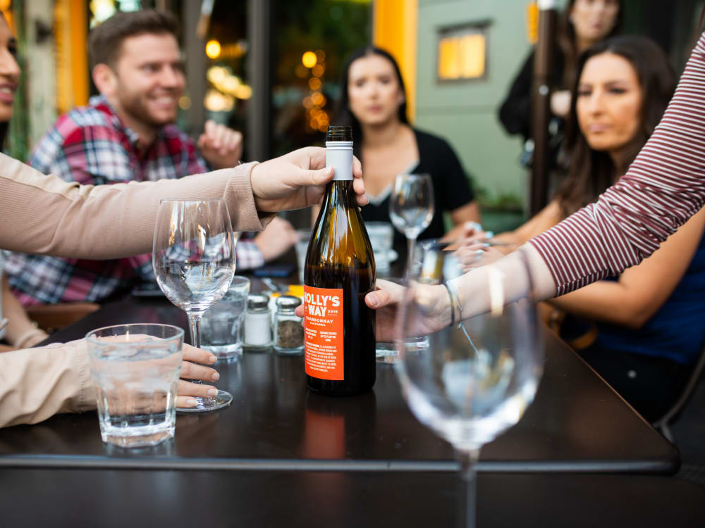Resident friends out on the town raising a toast near The Halsten at Chauncey Lane in Scottsdale, Arizona