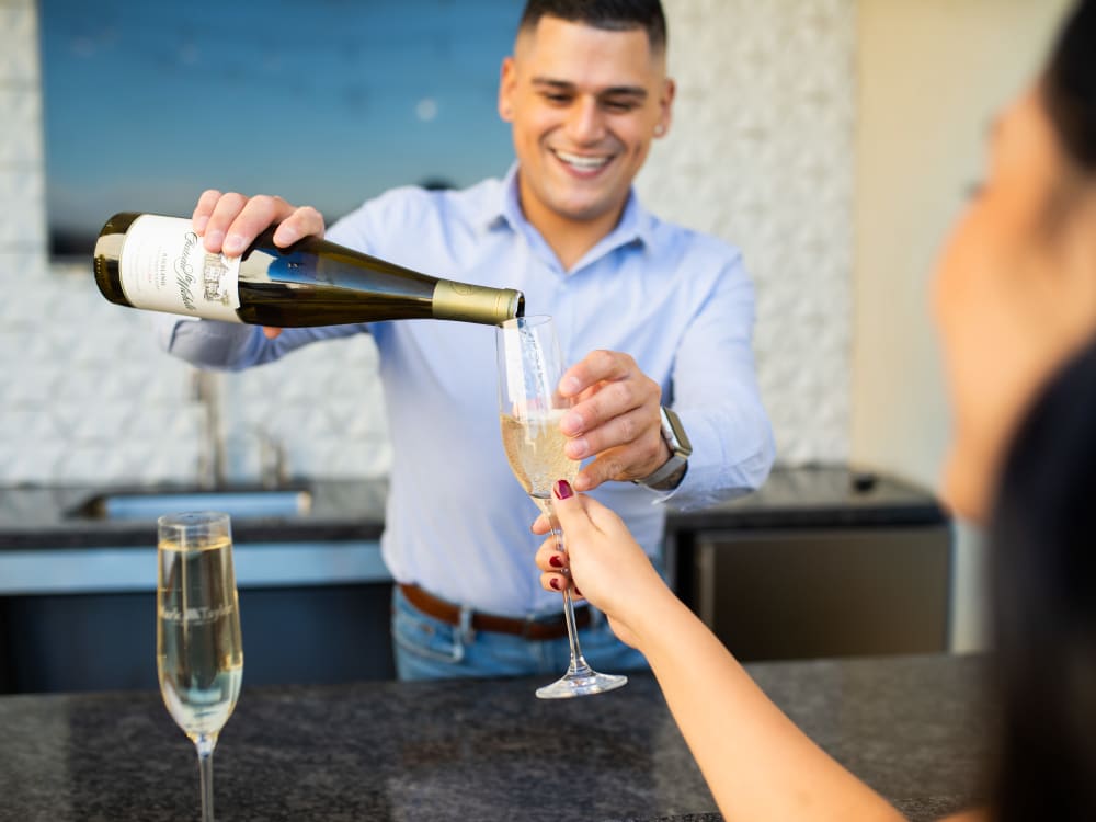Residents enjoying the bar in the clubhouse at Arista at Ocotillo in Chandler, Arizona