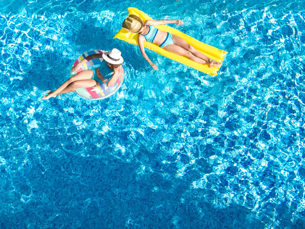 Two residents in the pool at TerraLane on Cotton in Surprise, Arizona