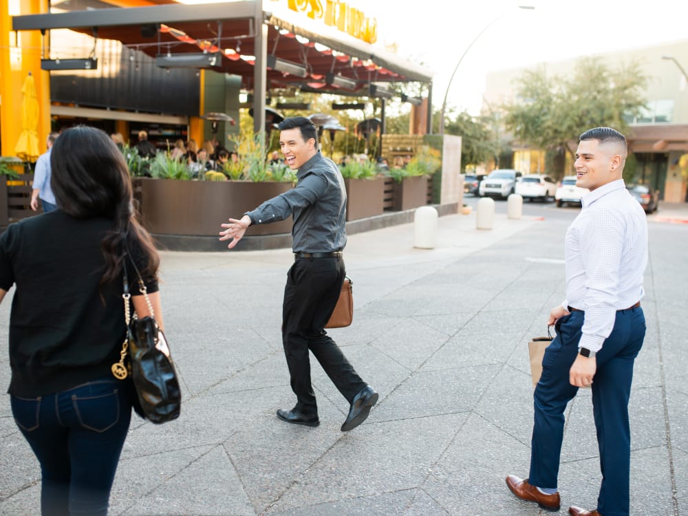 People with shopping bags near Gramercy Scottsdale in Scottsdale, Arizona