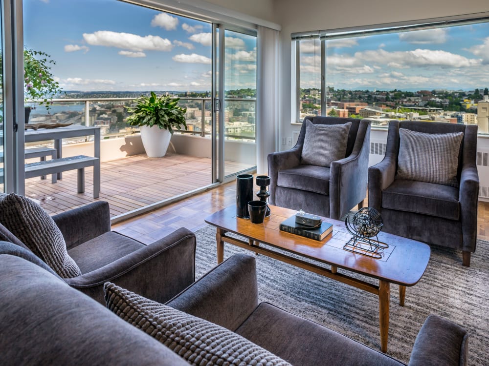 Spacious seating area and gorgeous Seattle views at Panorama Apartments in Seattle, Washington