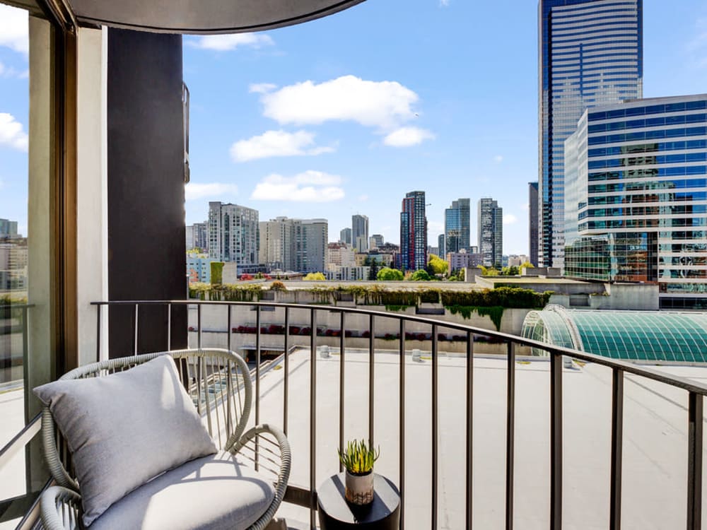 Beautifully furnished open-concept living area in a model home at Tower 801 in Seattle, Washington