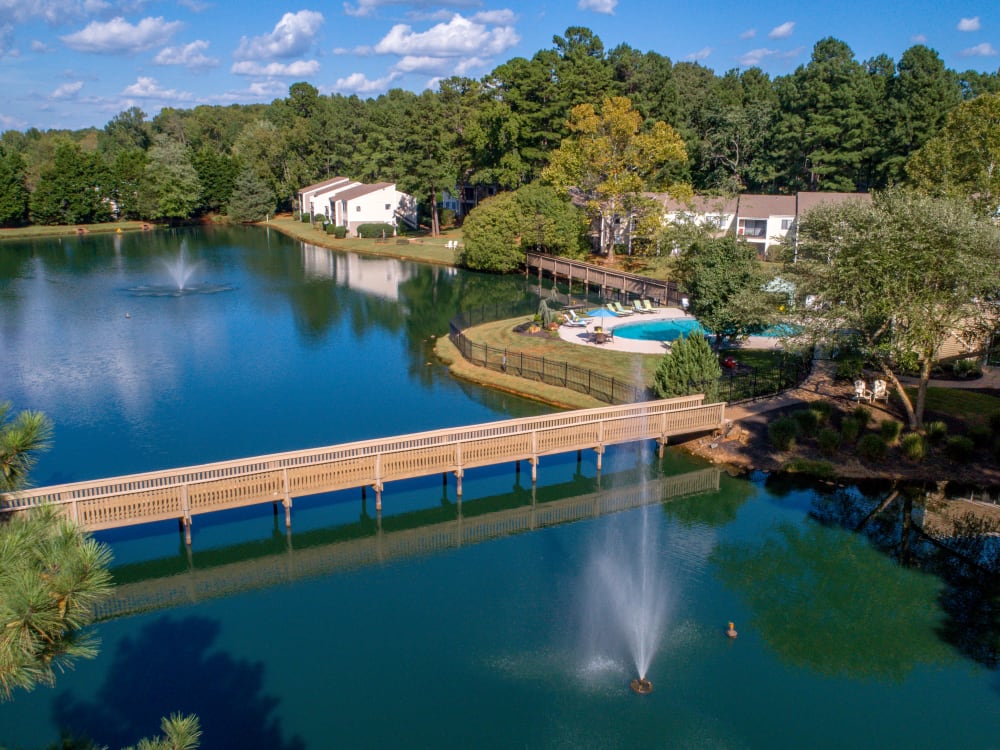 Aerial view of the footbridge across the middle of the pond at Pinewood Station in Hillsborough, North Carolina