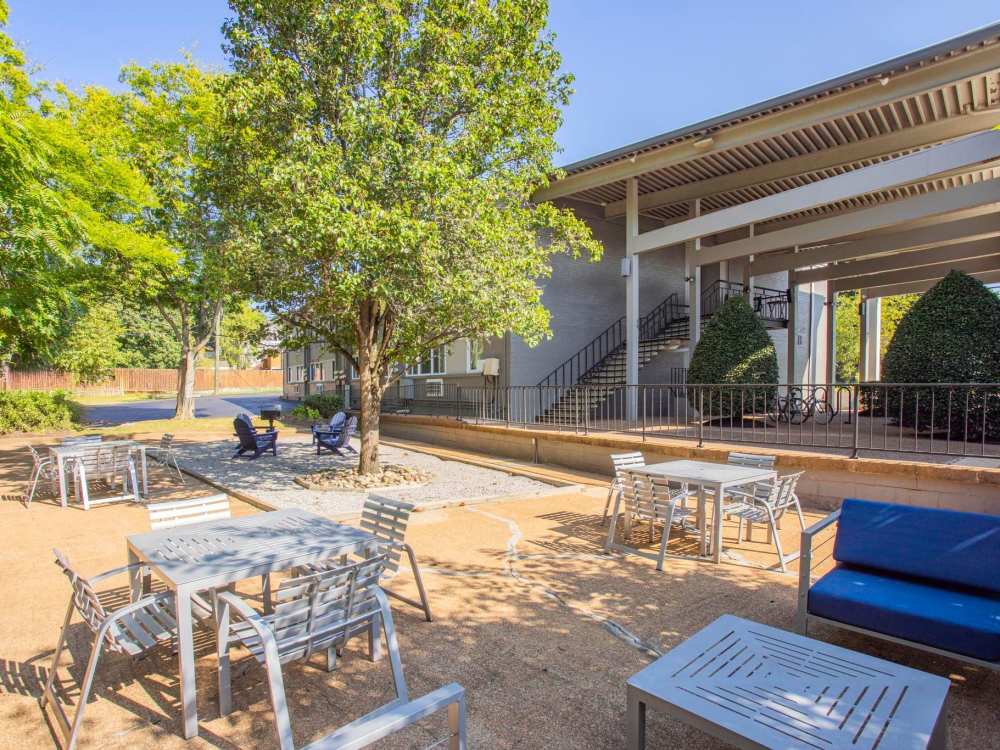 Outdoor Lounge Area with Grill and Corn Hole