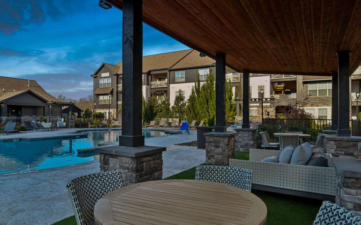 Residents cooling off in the outdoor swimming pool at The Apartments at Brayden in Fort Mill, South Carolina