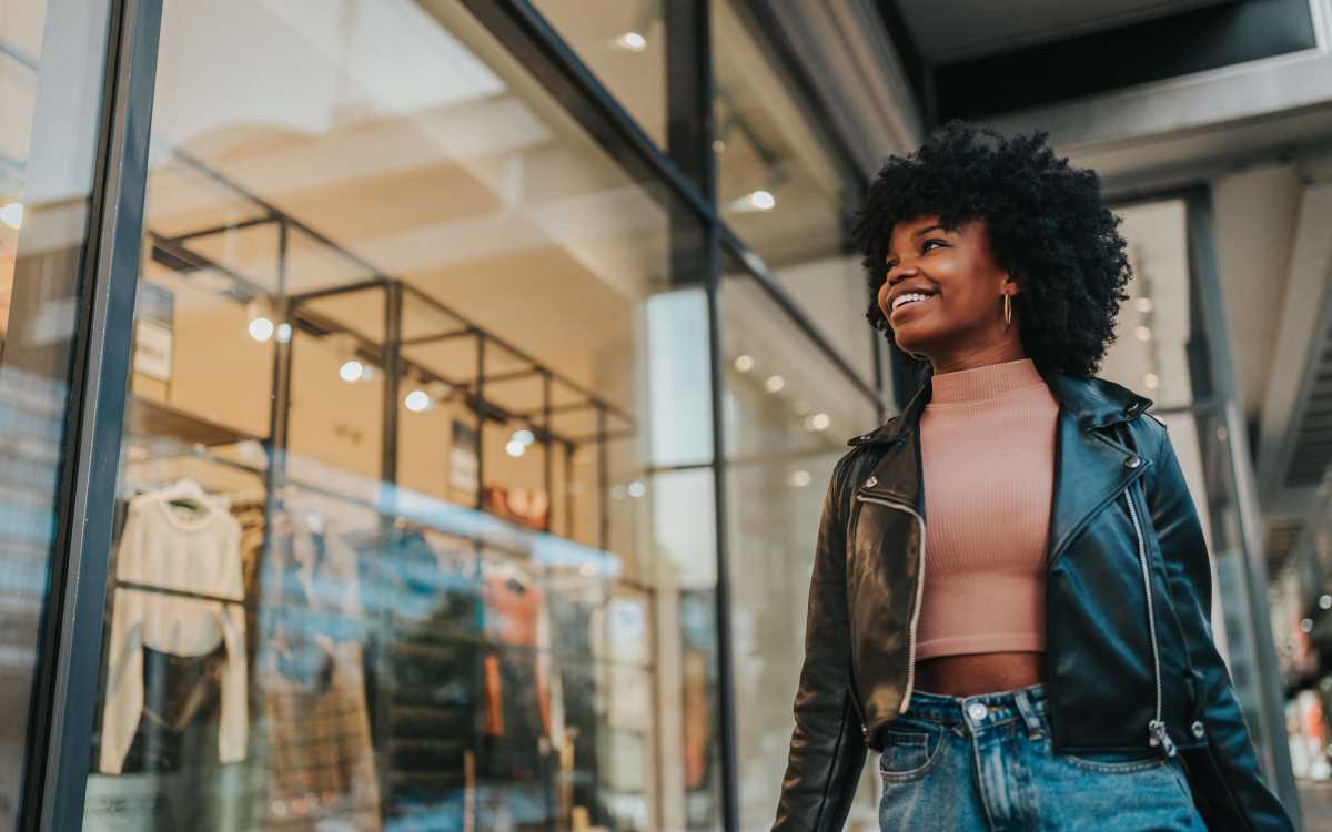 Image of woman walking down the street shopping