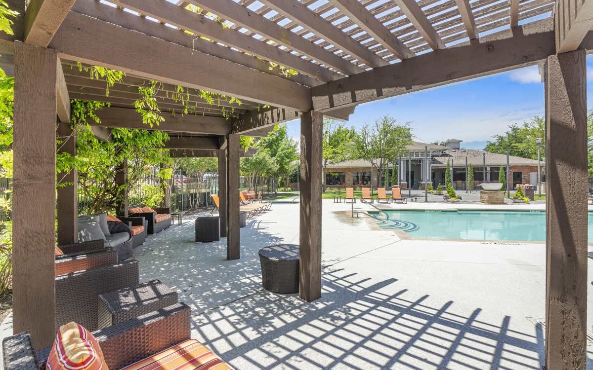 Seating area with a view of swimming pool at Cypress in McKinney, Texas