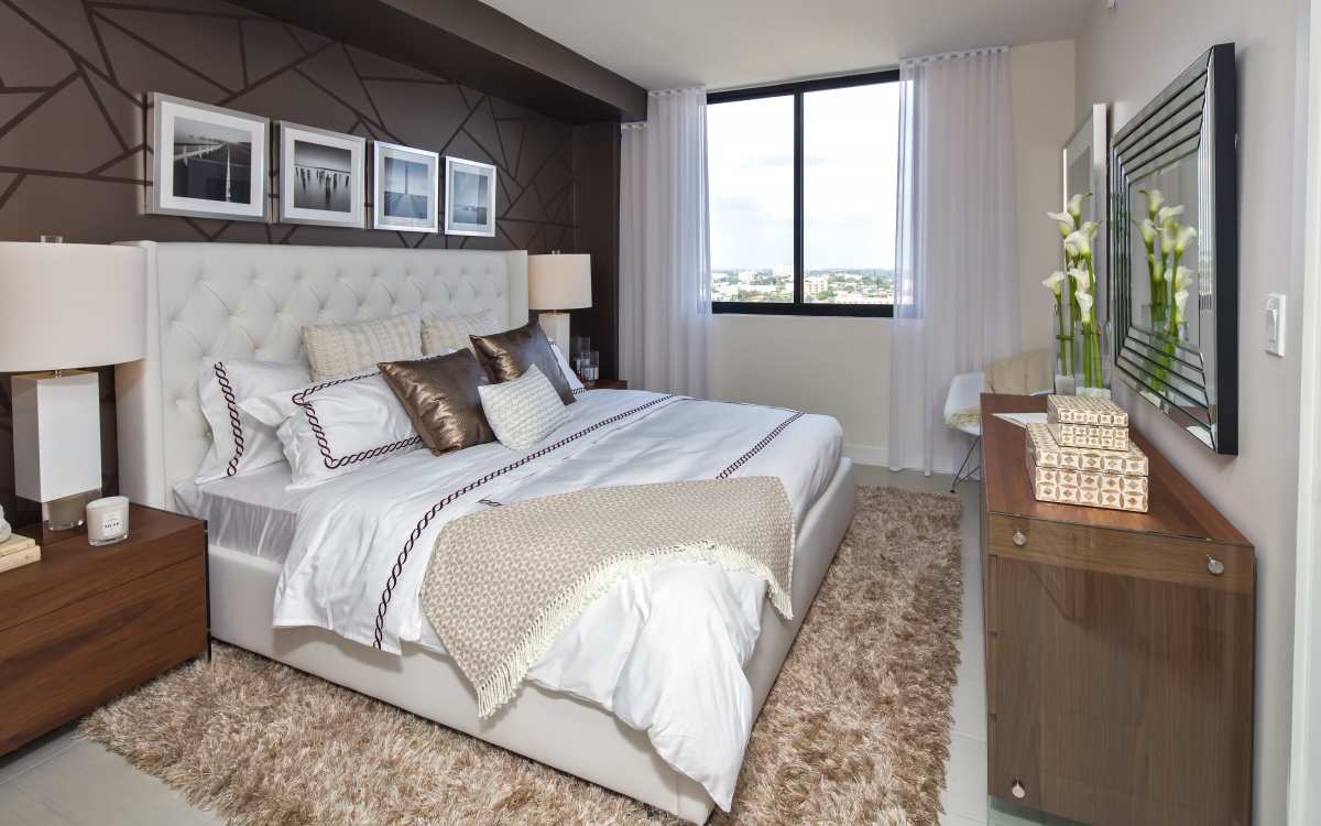Large comfortablebed in the spacious bedroom at InTown Apartments in Miami, Florida