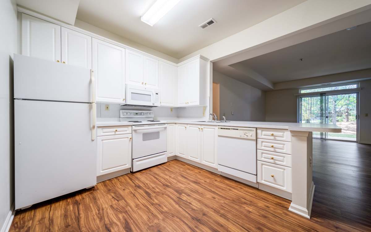 Classic kitchen with white cabinets and white appliances