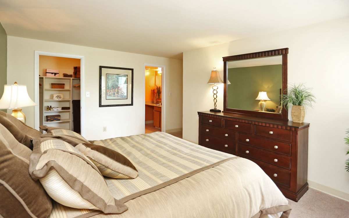 Modern bedroom with attached closet at Knights Bridge II in Burtonsville, Maryland