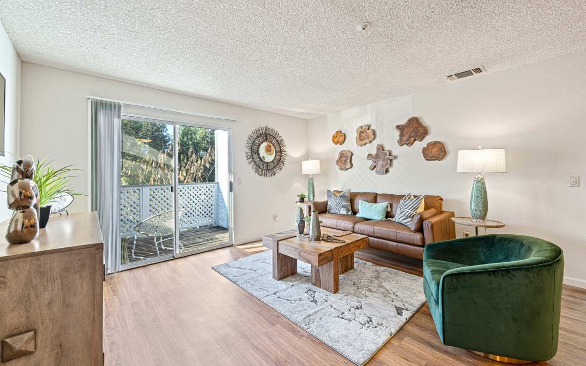Living room with attached patio at Country Brook Rental Condominiums in San Ramon, California